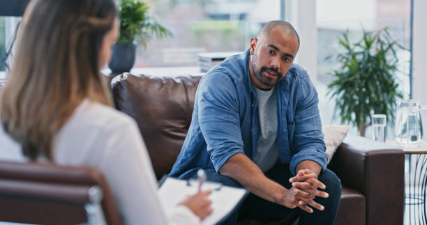 Adult male talking to a counselor