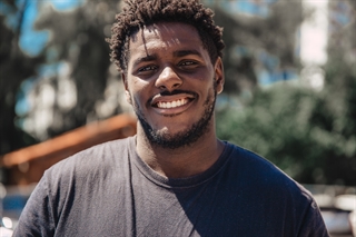 Male counseling client outdoors
